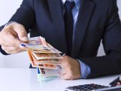 hands in the foreground with money